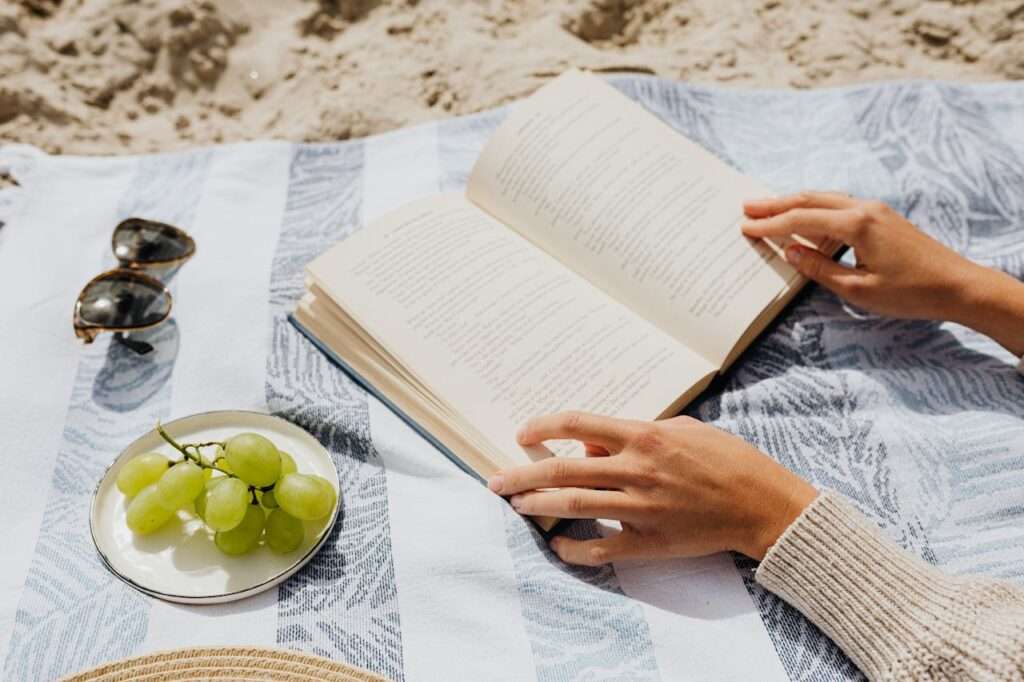 A women on beach blanket