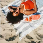 A women sunbathing on beach