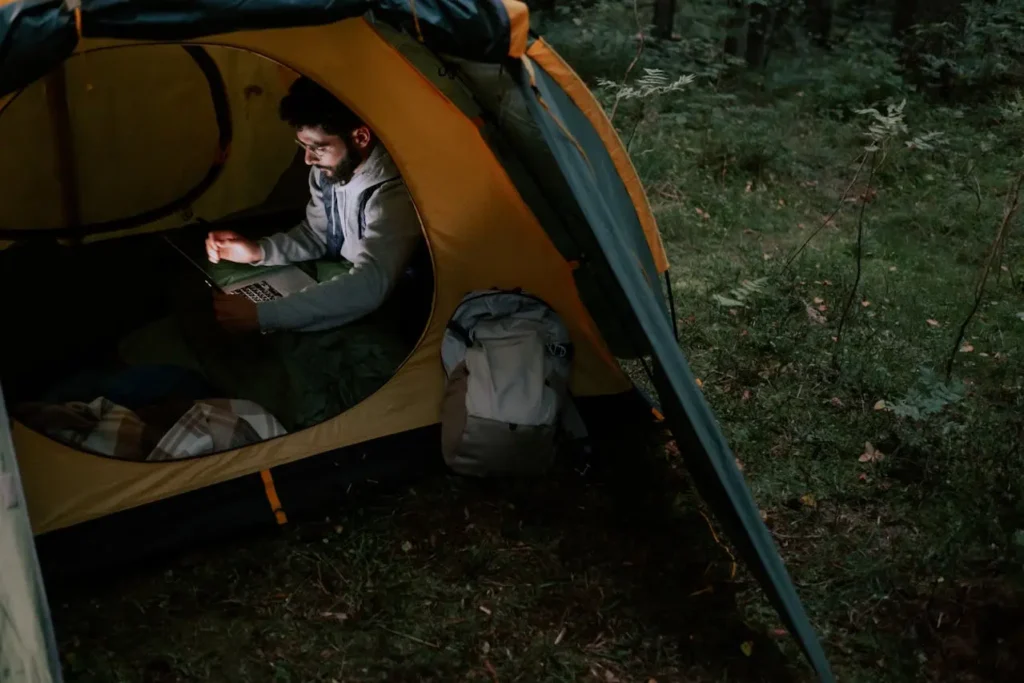 Man inside a tent, solo camping