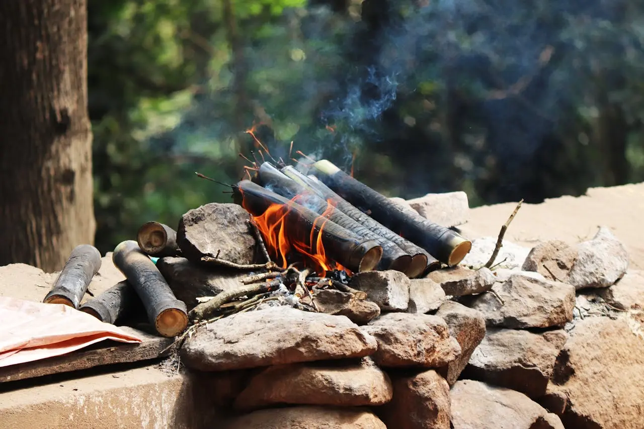 burning firewood on rock