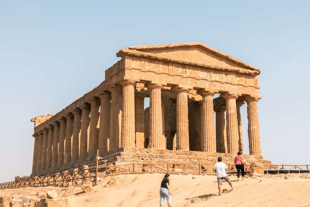 People near Ruins of the Temple of Concordia in Italy