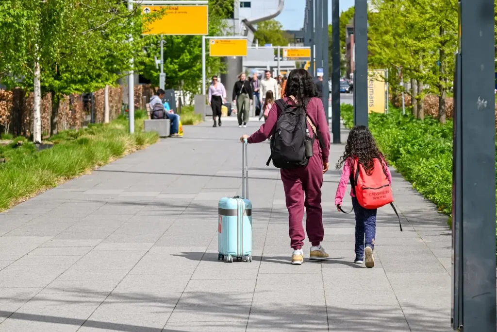 Mother and Daughter Walking at Eindhoven Airport